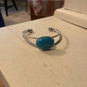 silver adjustable bracelet with blue stone